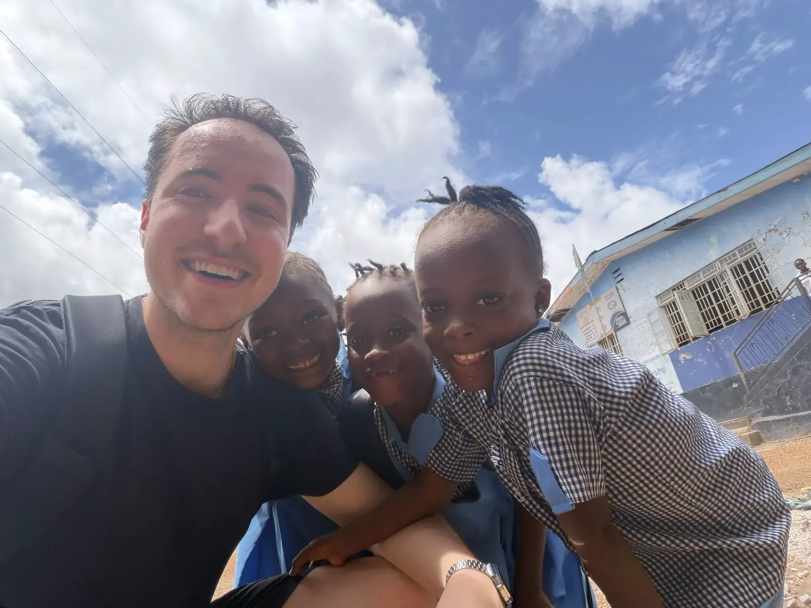 Capyo's founder with students at a partner school